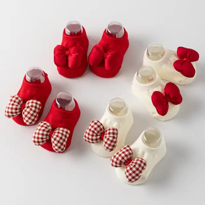 Chaussettes de noël à nœud rouge pour bébé