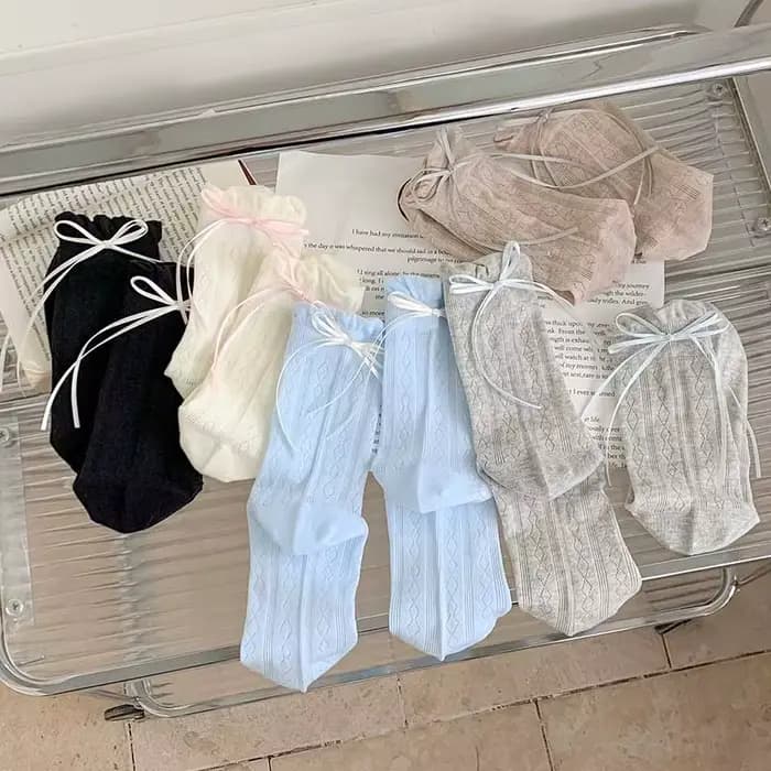 Chaussettes pour femmes Style coréen nouvelle couleur unie douce Lolita chaussettes fines mignon respirant arc mode japonaise chaussettes longues femme maille