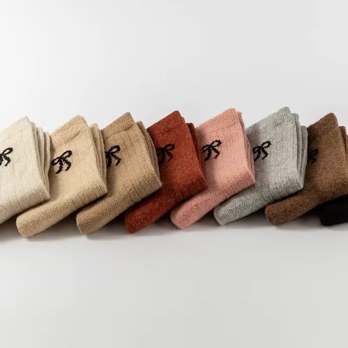 Chaussettes d'automne et d'hiver pour femmes, chaussettes chaudes en laine avec nœud, chaussettes douces à haute élasticité, chaussettes mi-tube en cachemire, chaussettes de couleur unie, chaussettes