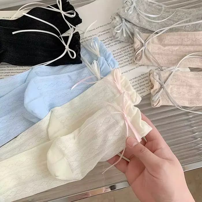 Chaussettes pour femmes Style coréen nouvelle couleur unie douce Lolita chaussettes fines mignon respirant arc mode japonaise chaussettes longues femme maille