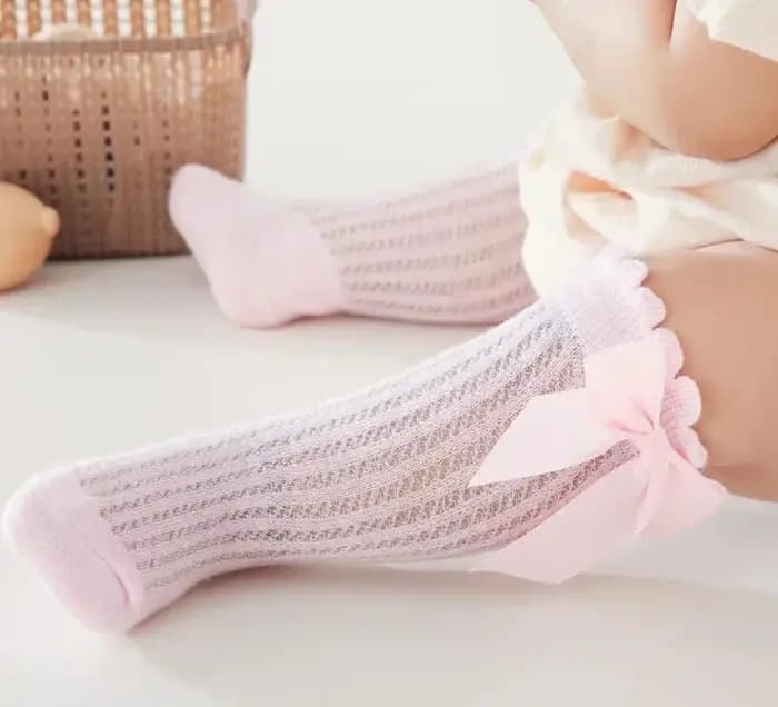 Chaussettes Tube hautes avec nœud papillon rouge