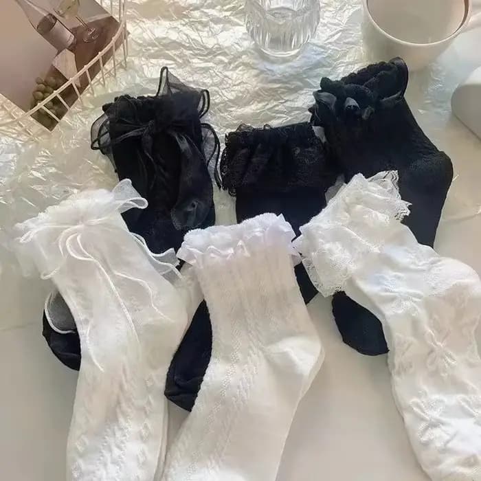 Chaussettes mi-tube en dentelle unie avec nœud à volants